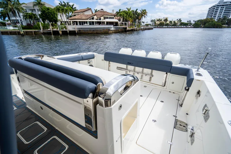 Slide: The Image of 2016 Boston Whaler 420 Outrage boat interior, featuring spacious seating and waterfront view. - 36