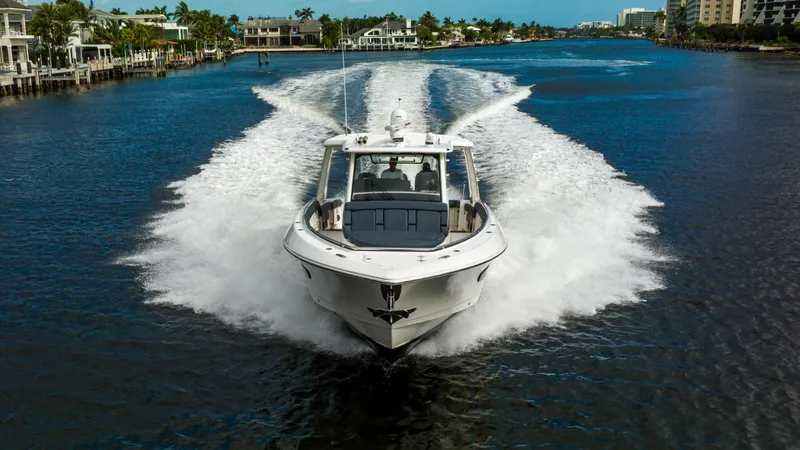 Slide: The Image of 2016 Boston Whaler 420 Outrage cruising on a scenic waterway. - 4