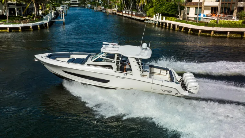 Slide: The Image of 2016 Boston Whaler 420 Outrage cruising on a scenic waterway. - 7