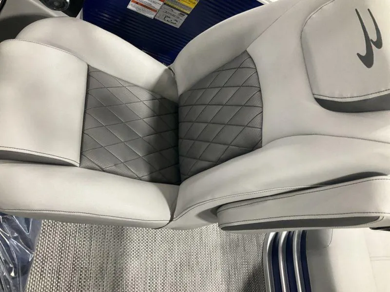 Slide: The Image of 2023 Bennington 23 LSB boat seat with gray and white upholstery. - 12