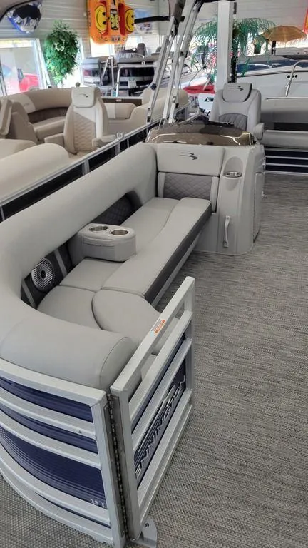 Slide: The Image of 2023 Bennington 23 LSB pontoon boat interior with luxurious seating and modern amenities. - 15