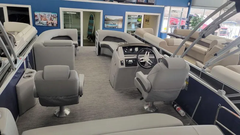 Slide: The Image of 2023 Bennington 23 LSB pontoon boat interior with gray seating and modern helm. - 20
