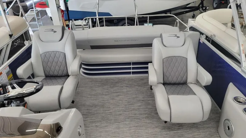 Slide: The Image of 2023 Bennington 23 LSB boat interior with plush seating and modern design. - 5