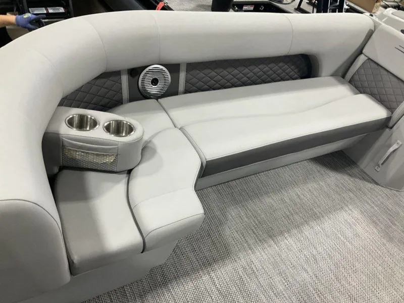 Slide: The Image of 2023 Bennington 23 LSB boat interior with gray cushioned seating and cup holders. - 6