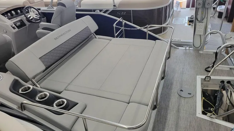 Slide: The Image of 2023 Bennington 23 LSB pontoon boat interior with spacious seating and cup holders. - 9