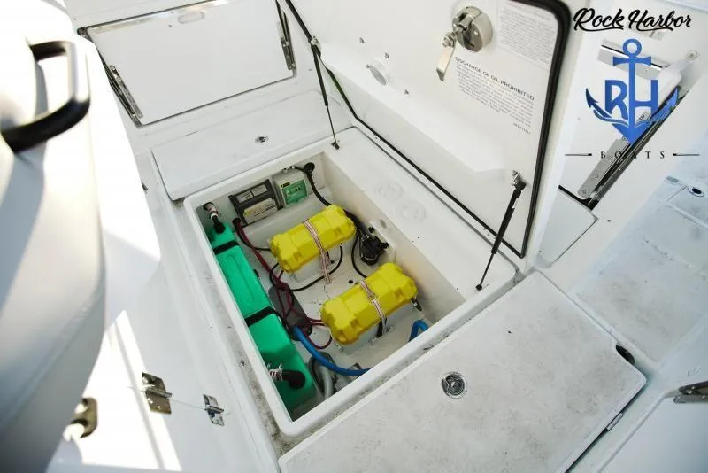 Slide: The Image of Beneteau Flyer 8 SUNdeck 2022 boat battery compartment with yellow and green batteries. - 10