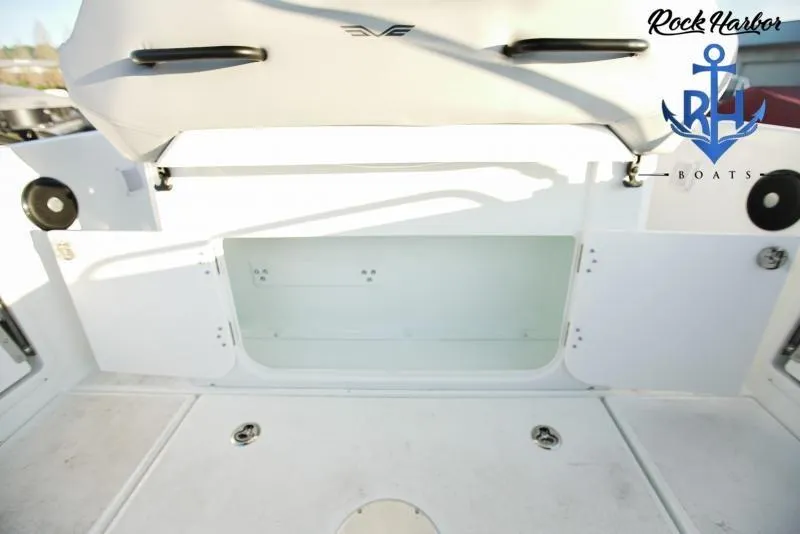 Slide: The Image of 2022 Beneteau Flyer 8 SUNdeck boat interior with storage compartment, Rock Harbor Boats logo. - 12