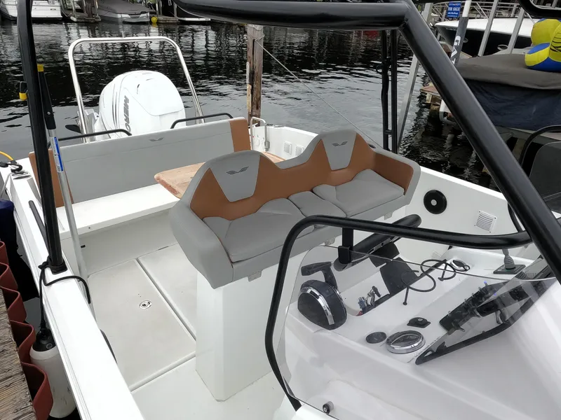 Slide: The Image of 2022 Beneteau Flyer 8 SUNdeck boat interior with seating and control panel. - 18