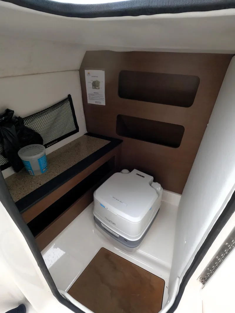 Slide: The Image of 2022 Beneteau Flyer 8 SUNdeck interior cabin with portable toilet. - 20
