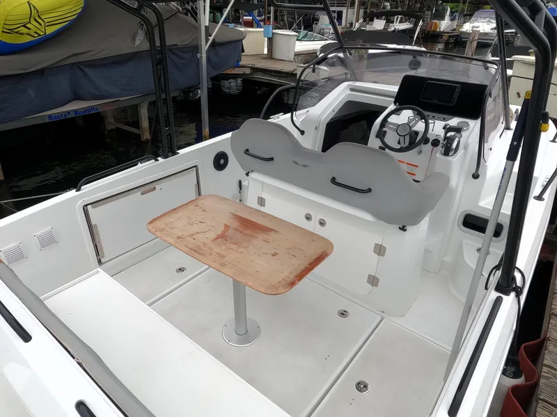 Slide: The Image of 2022 Beneteau Flyer 8 SUNdeck boat interior with helm, seating, and table. - 29