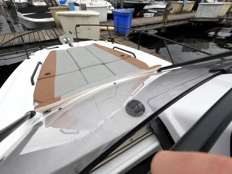 Slide: The Image of 2022 Beneteau Flyer 8 SUNdeck at marina, featuring spacious sunbathing area. - 35