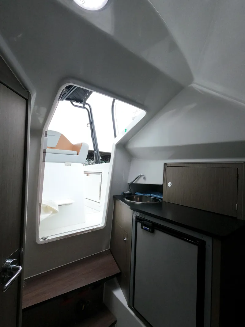 Slide: The Image of Interior cabin of 2022 Beneteau Flyer 8 SUNdeck with kitchenette and steps to deck. - 39