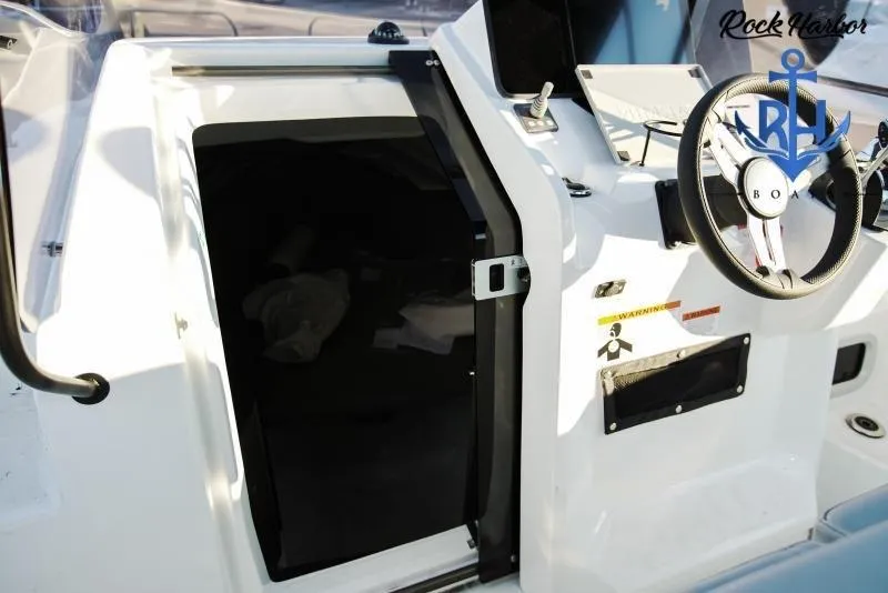 Slide: The Image of 2022 Beneteau Flyer 8 SUNdeck cockpit with steering wheel and cabin entrance. - 8
