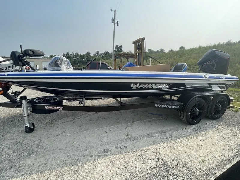 The Image of 2024 Phoenix 21 PHX bass boat on a trailer in a gravel lot. - 1
