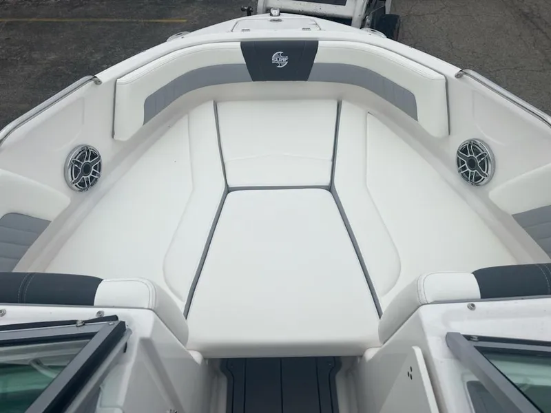 Slide: The Image of 2023 Chaparral 21 Surf boat with spacious bow seating and modern design. - 2