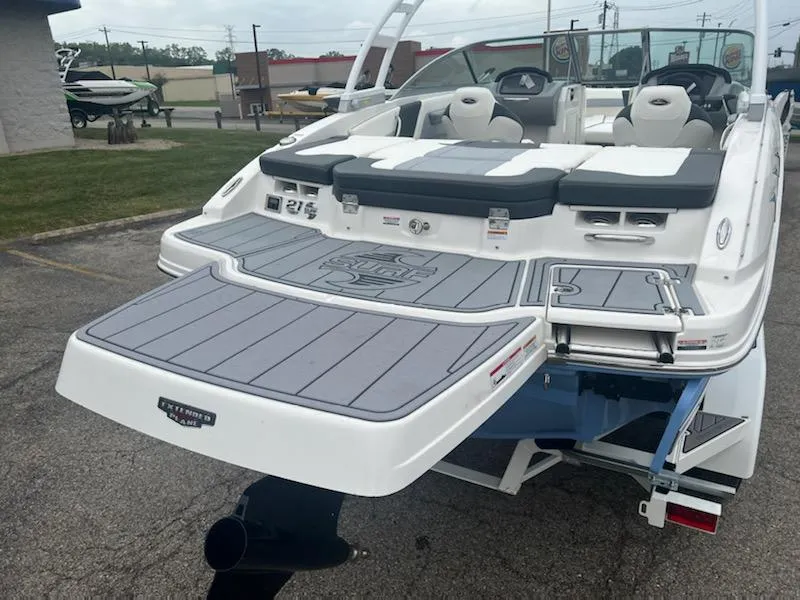 Slide: The Image of 2023 Chaparral 21 Surf boat, rear view with swim platform and seating. - 7