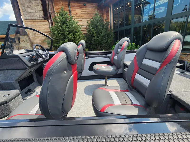 Slide: The Image of 2023 Ranger VX1788 WT boat interior with gray and red seats. - 2