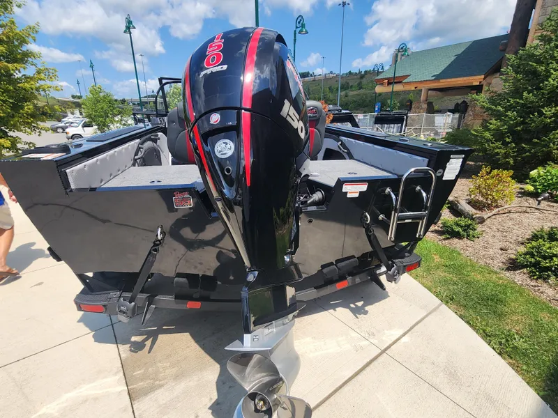Slide: The Image of 2023 Ranger VX1788 WT boat with powerful outboard motor, parked on a sunny day. - 4