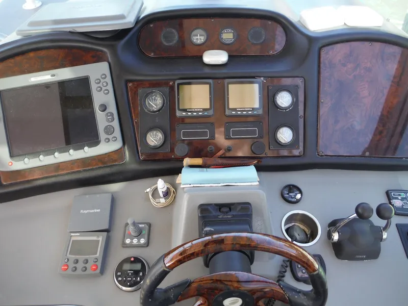 Slide: The Image of Dashboard of a 2005 Cruisers Yachts 455 Express Motoryacht with navigation and control instruments. - 11