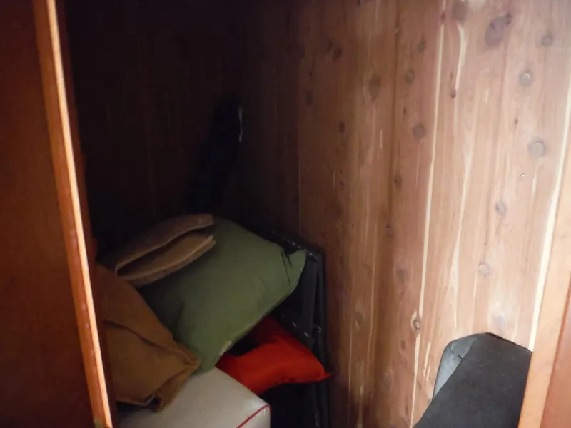 Slide: The Image of Storage compartment in 2005 Cruisers Yachts 455 Express Motoryacht with cushions and pillows. - 30