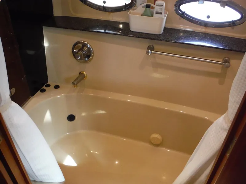 Slide: The Image of Luxurious bathtub in 2005 Cruisers Yachts 455 Express Motoryacht bathroom. - 40