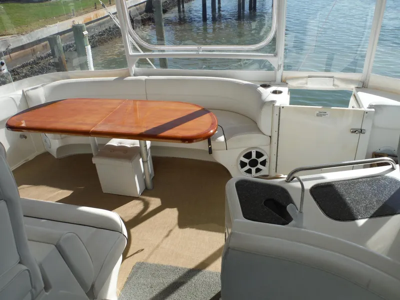 Slide: The Image of 2005 Cruisers Yachts 455 Express Motoryacht interior with seating and table. - 7