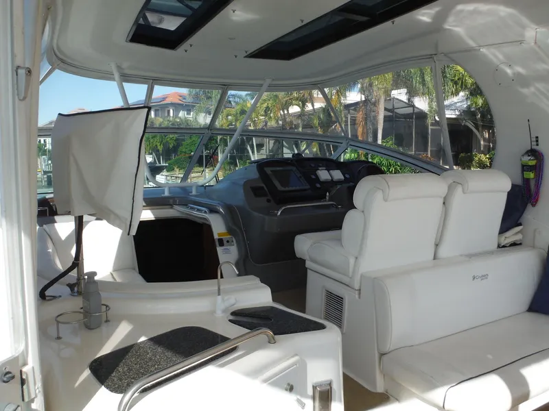 Slide: The Image of 2005 Cruisers Yachts 455 Express Motoryacht interior with helm and seating area. - 3