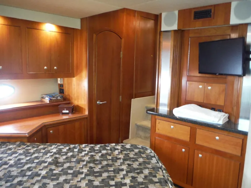 Slide: The Image of Luxurious cabin interior of 2005 Cruisers Yachts 455 Express Motoryacht with wood cabinetry. - 33