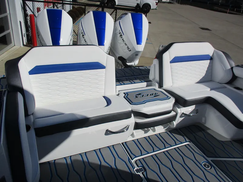 Slide: The Image of 2021 Sunsation 40CCX boat interior with seating and triple outboard engines. - 13