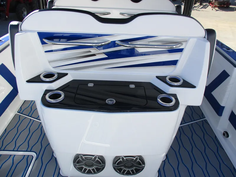 Slide: The Image of 2021 Sunsation 40CCX boat interior with cup holders and speakers. - 16