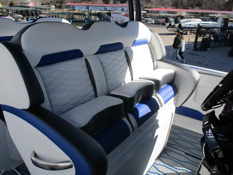 Slide: The Image of 2021 Sunsation 40CCX boat interior with white and blue seating. - 20