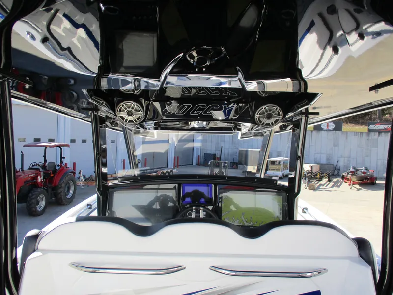 Slide: The Image of 2021 Sunsation 40CCX boat interior with advanced dashboard and sound system. - 22