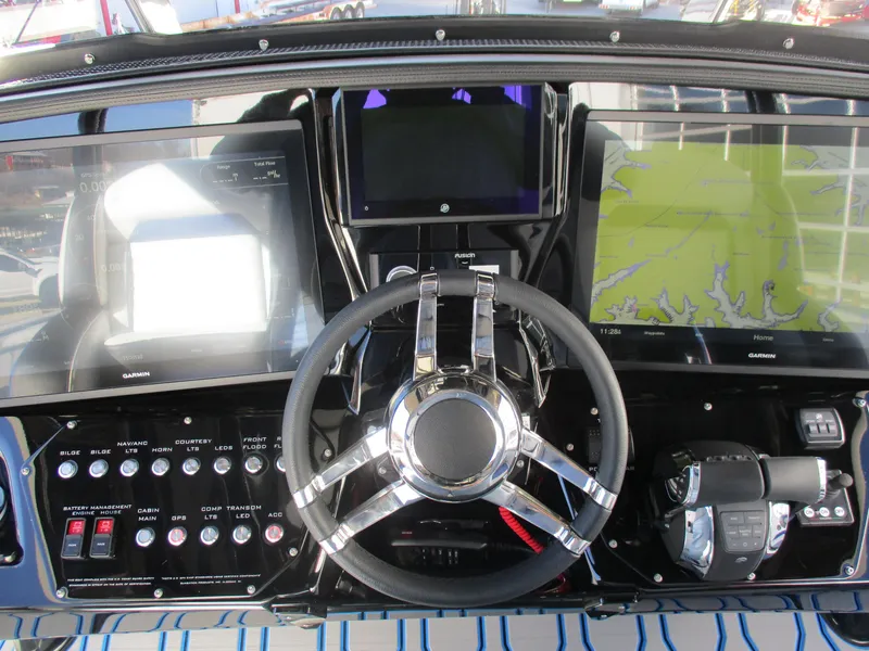 Slide: The Image of 2021 Sunsation 40CCX boat dashboard with advanced navigation and control systems. - 26