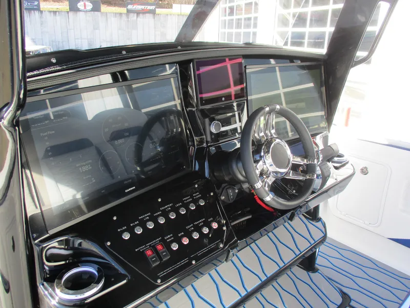 Slide: The Image of 2021 Sunsation 40CCX boat dashboard with modern controls and steering wheel. - 29