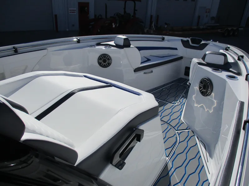 Slide: The Image of 2021 Sunsation 40CCX boat interior with white seating and blue accents. - 30