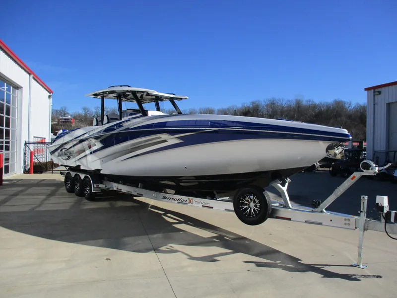 Slide: The Image of 2021 Sunsation 40CCX powerboat on a trailer outside a storage facility. - 5