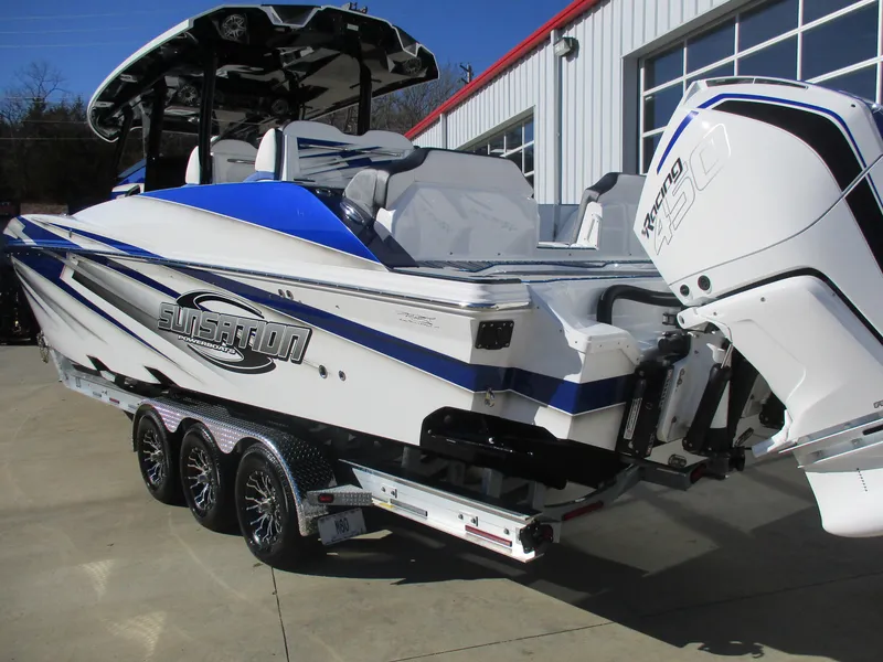 Slide: The Image of 2021 Sunsation 40CCX powerboat on a trailer, featuring twin outboard engines. - 8