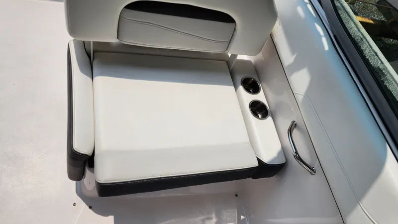 Slide: The Image of 2017 Regal 22 FasDeck boat seat with cup holders and sleek design. - 11