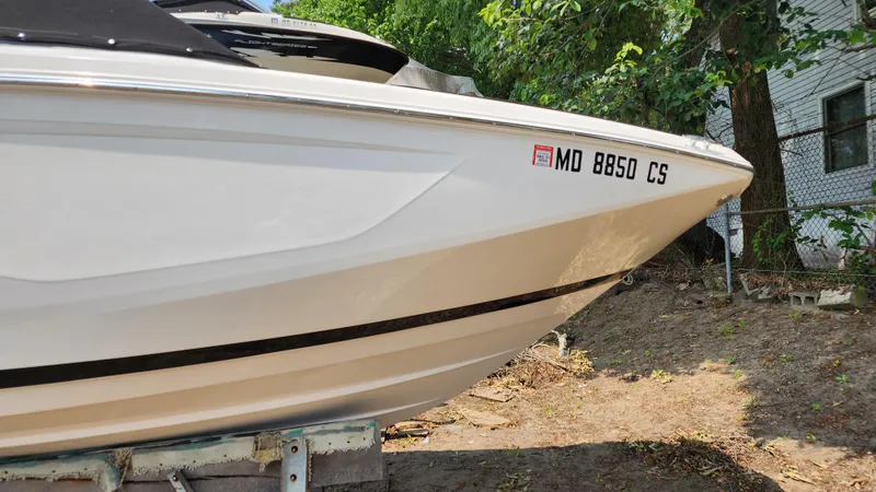Slide: The Image of 2017 Regal 22 FasDeck boat on trailer, side view with registration number. - 12