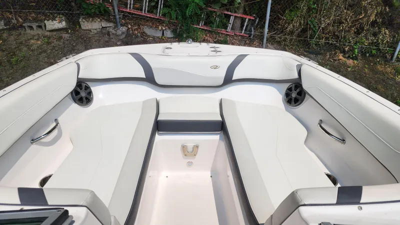 Slide: The Image of 2017 Regal 22 FasDeck boat interior with white seating and speakers. - 29
