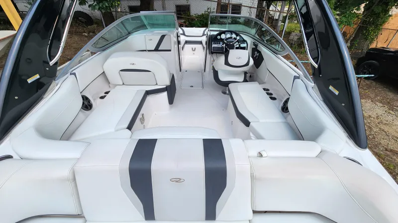 Slide: The Image of 2017 Regal 22 FasDeck boat interior with spacious seating and modern dashboard. - 4