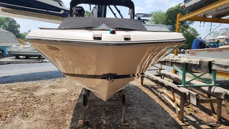 Slide: The Image of 2017 Regal 22 FasDeck boat on trailer, front view, in a boatyard. - 7