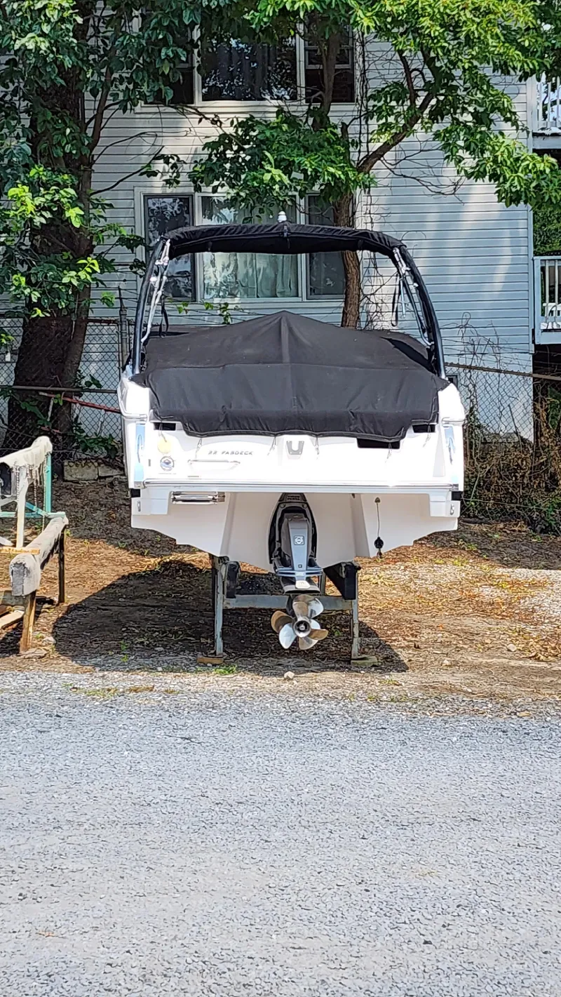 Slide: The Image of 2017 Regal 22 FasDeck boat with cover, parked outdoors. - 8