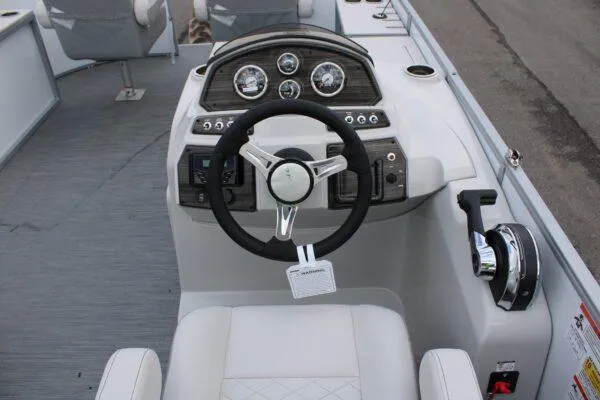 Slide: The Image of 2023 Lowe SF212 boat dashboard with steering wheel and control panel. - 10