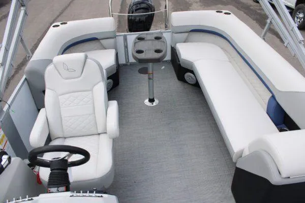 Slide: The Image of 2023 Lowe SF212 pontoon boat interior with white seating and steering console. - 4