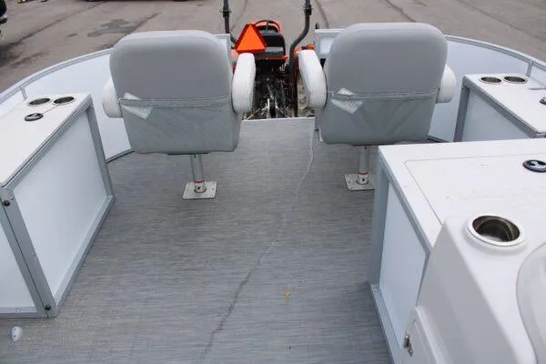 Slide: The Image of 2023 Lowe SF212 boat interior with two seats and storage compartments. - 5