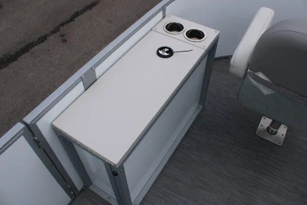 Slide: The Image of 2023 Lowe SF212 boat interior with cup holders and storage compartment. - 7
