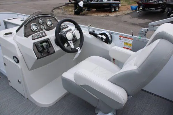 Slide: The Image of 2023 Lowe SF212 boat cockpit with steering wheel and control panel. - 8