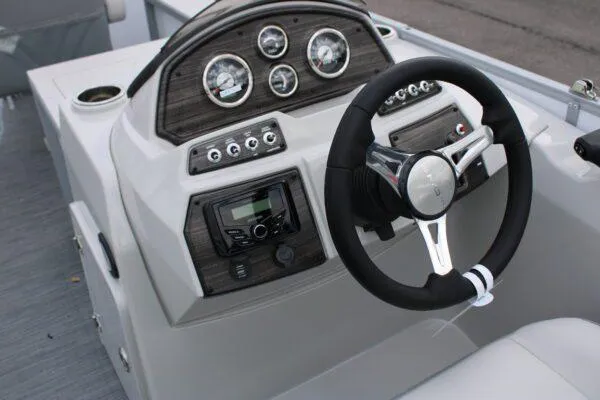Slide: The Image of 2023 Lowe SF212 boat dashboard with steering wheel and control panel. - 9