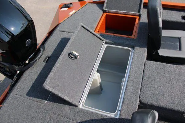 Slide: The Image of 2023 Lowe Stinger 178 boat with open storage compartments and seating. - 10